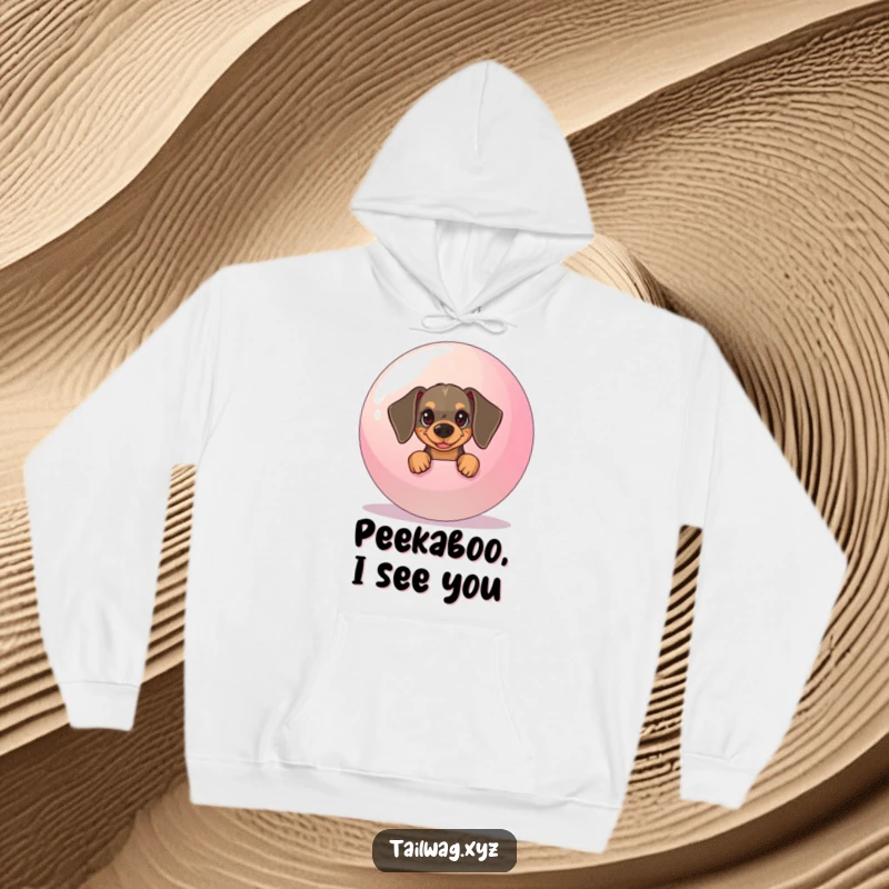 Funny Dachshund Hoodie: Mischievous dachshund hiding behind a large bouncy ball, offering warm and humorous comfort.